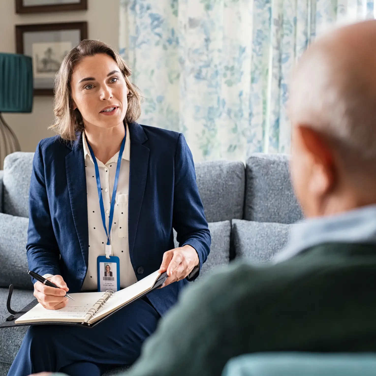 Care coordinator meeting with an older adult in a home setting, representing trusted care coordination services in New York and Putnam County.