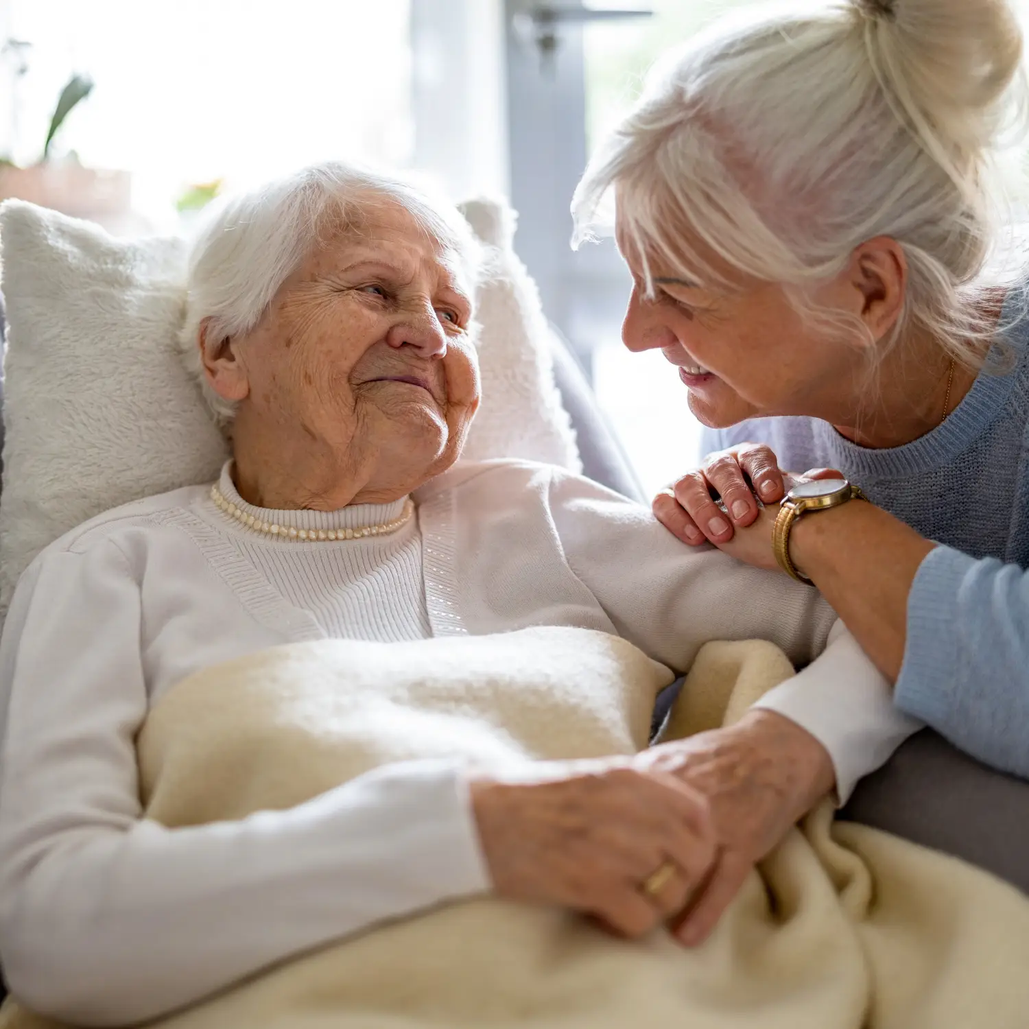 align-services-family-care-support-orange-county-new-york Family member sitting with an older adult at home, representing compassionate care coordination for families